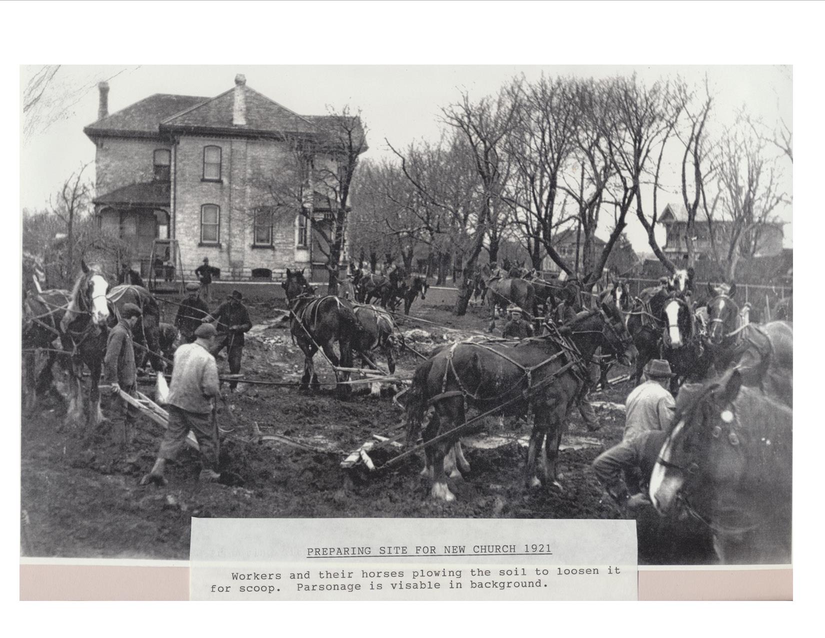 men and teams of horses with single furrow ploughs on the building site